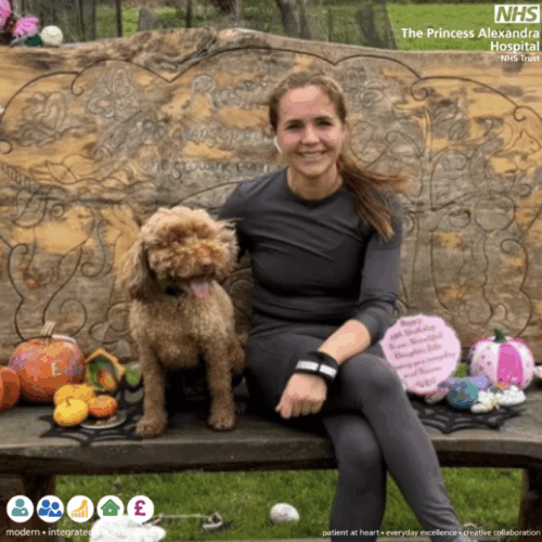 Lois Jackson preparing to take on the London Marathon in honour of her beloved daughter Edie. The picture shows Lois Jackson sat on a bench with dog.