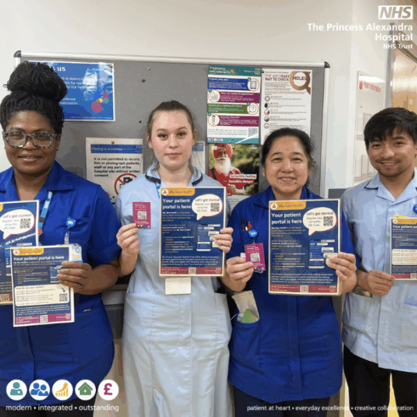 Nurses holding promotion material for the online patient portal, NHS App