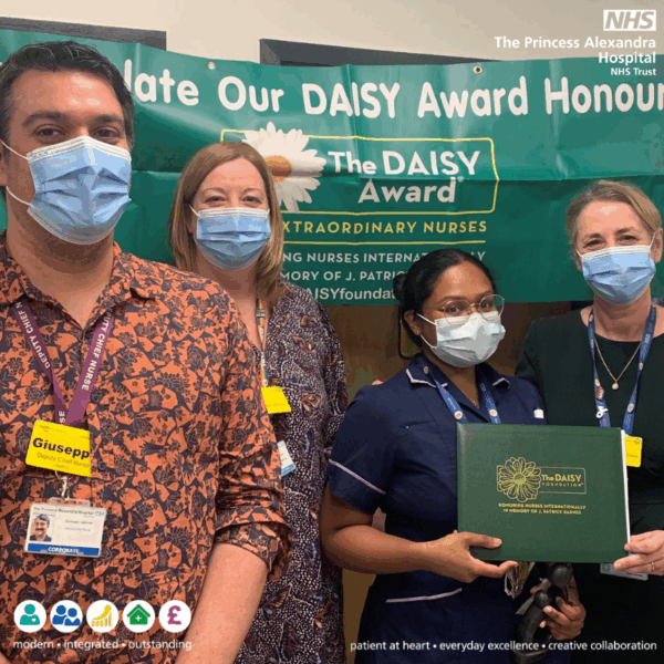 Jesse Loganathan receiving her Daisy award.