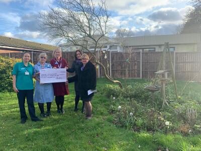 Bank donation to tranquil gardens at hospital ward